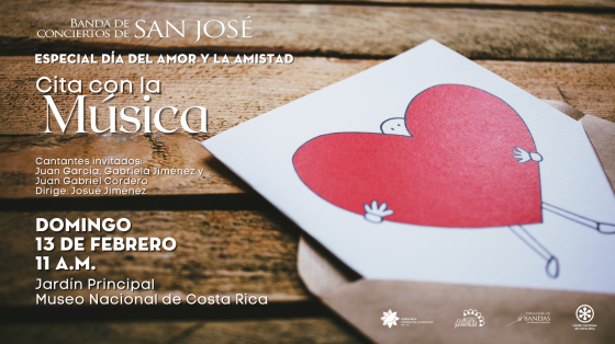 Concierto Especial del Día del Amor y la Amistad "Cita con la Música" - Banda de Conciertos de San José Tarjeta con corazón sobre una mesa de madera