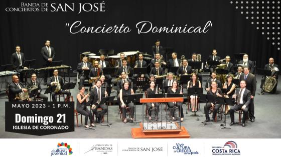 Concierto Dominical - Banda de Conciertos de San José Músicos en un teatro con fondo oscuro