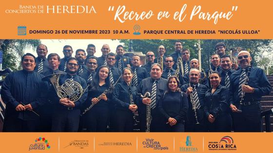 Concierto "Recreo en el Parque" | Banda de Conciertos de Heredia foto de los músicos de la Banda de Heredia vestidos de negro con sus instrumentos sonriendo a la cámara