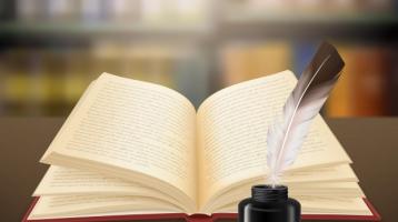 Libro abierto con una pluma encima